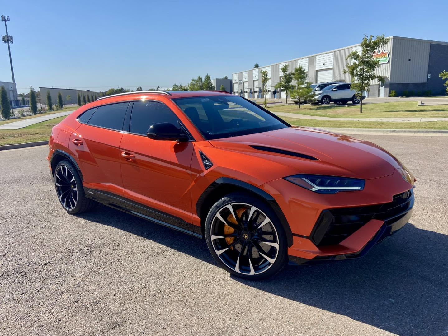 Bright orange color-change wrap on a Lamborghini Urus by Wrap It Up, Edmond OK