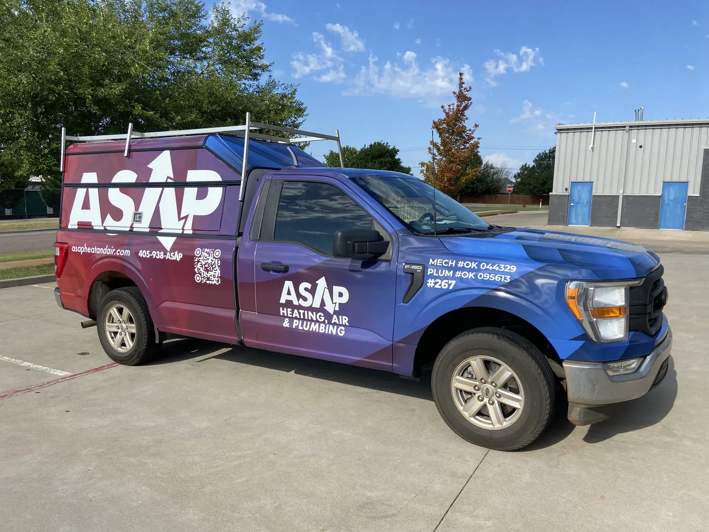 ASAP Heating, Air and Plumbing Ford F-150 with a full red and blue wrap covering the cab, bed, and topper