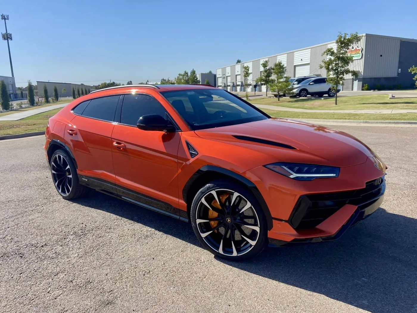 Lamborghini Urus in a bright orange full color change wrap