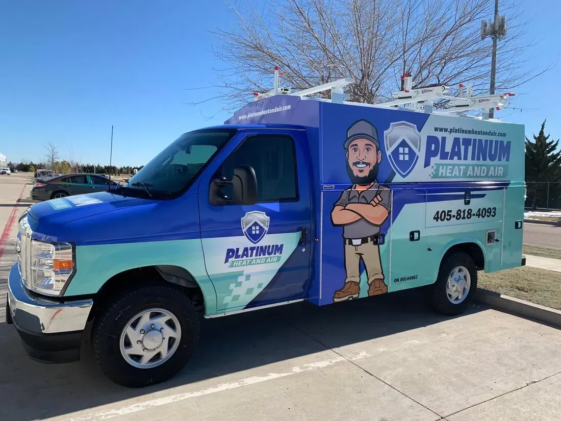 Platinum Heat and Air Ford service body truck with a blue and teal fleet wrap featuring a technician mascot